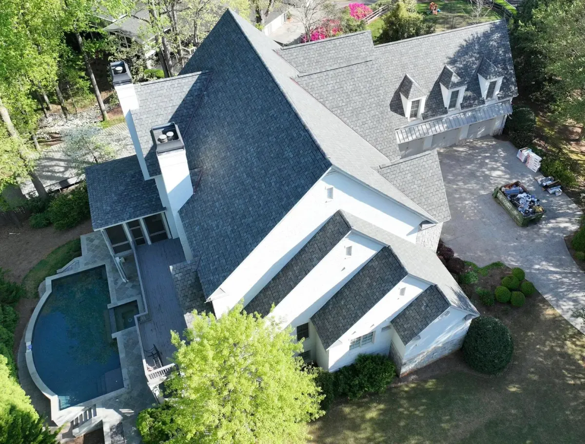 Cornerstone crew completing a residential shingle roof