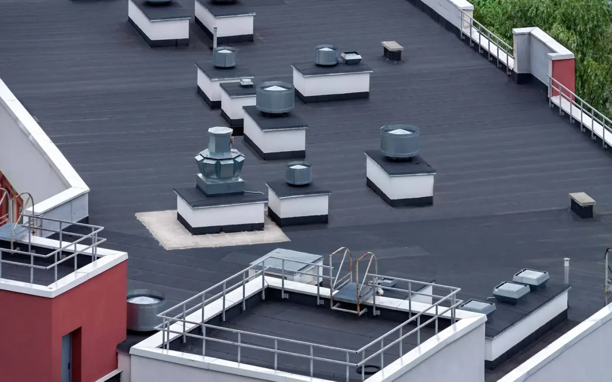 Overhead view of a coated low-slope commercial roof