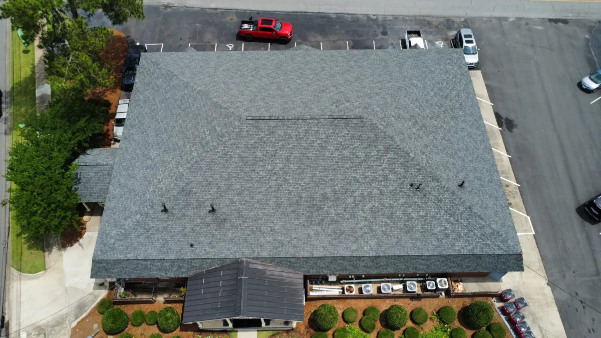A commercial low-slope roofing system under installation