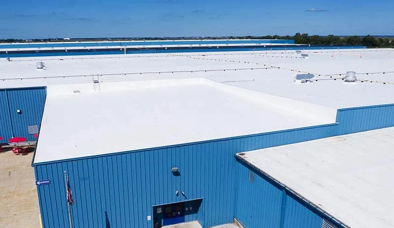 White TPO membrane roof over a large commercial building